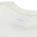 Camiseta Oakley x Piet Foil Nano Logo Bone Branca