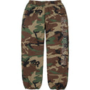 Calça Track Supreme Ripstop Spellout Camuflada